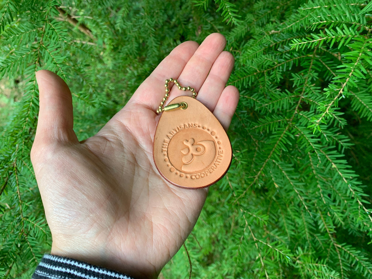 Leather keychain in the palm of a woman&#39;s hand